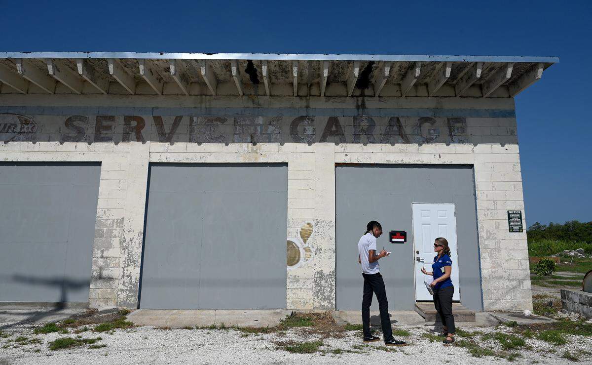 New Senior Editor Ryan Callihan interviews Dr. Angela Collins outside a new aquaculture facility in Rubonia in August, 2023.