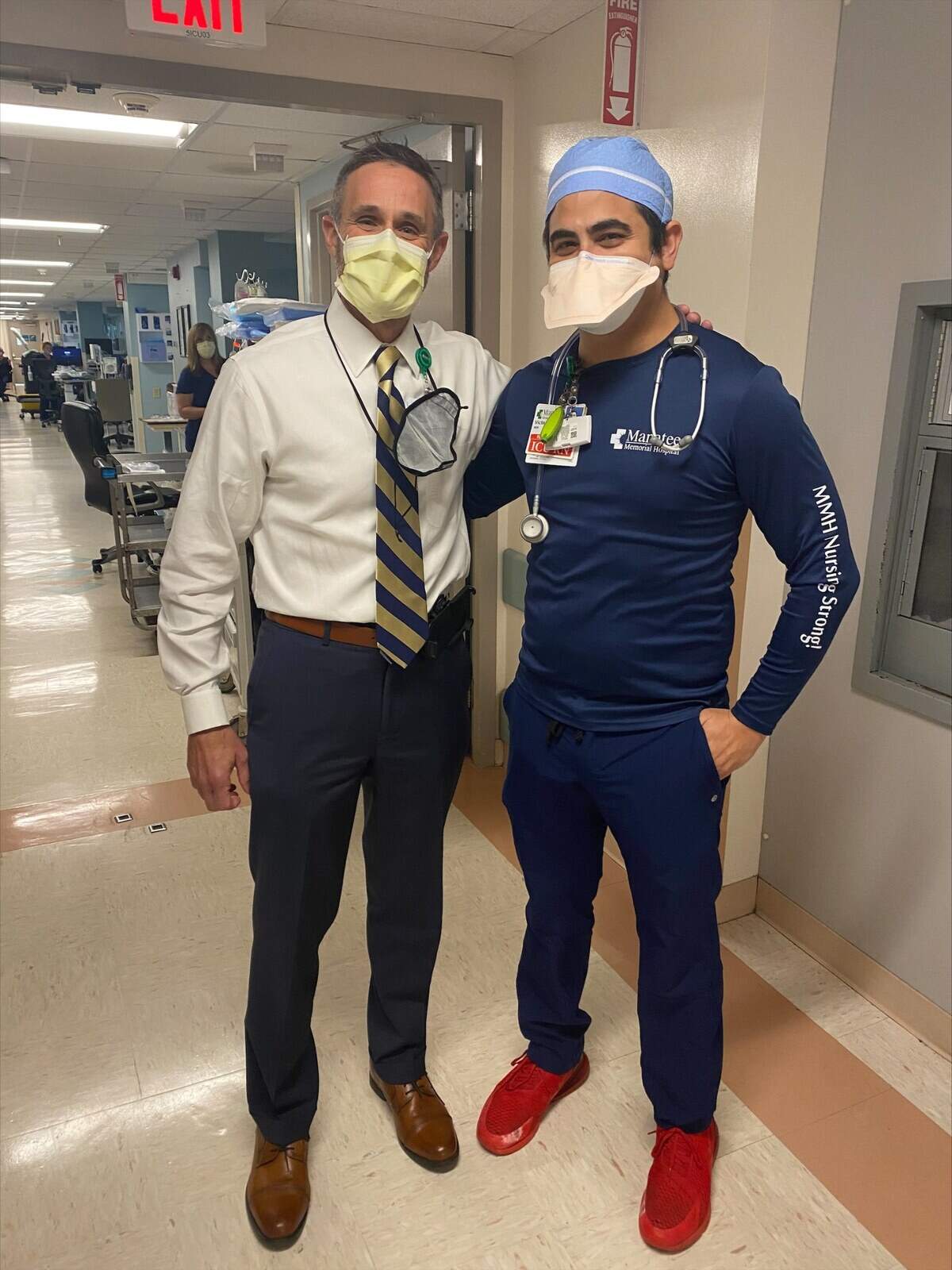 Tom McDougal, left, has been getting to know the staff at Manatee Memorial Hospital since starting work there Aug. 23. He is shown with registered nurse Victor Tirado.