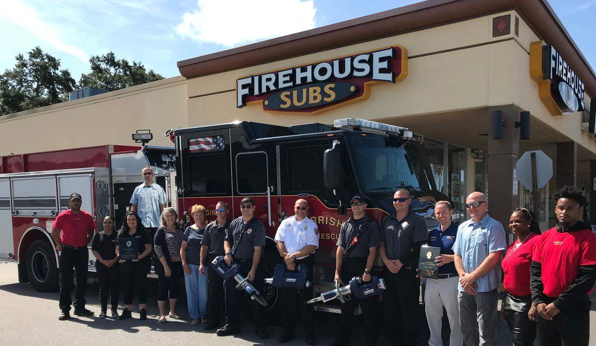 Firefighters, Firehouse Subs staff, and representatives of Firehouse Subs Public Safety Foundation gathered as the Parrish Fire District received more than $30,000 of life-saving equipment on Thursday.