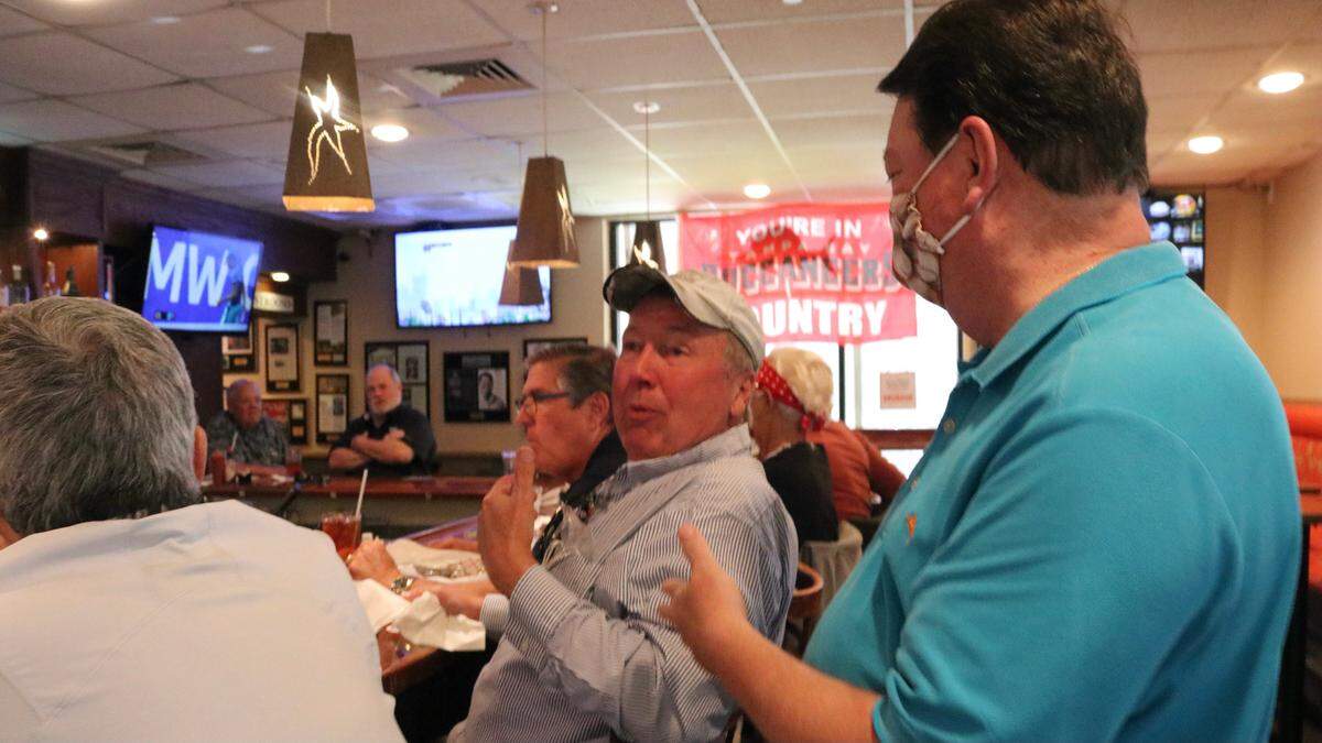 4/27/2021--021--Restaurant owner John Horne visits with guests at the Anna Maria Oyster Bar Restaurant, 1525 51st Ave. E., Ellenton. Horne says he has had difficulty recruiting more associates to spread the workload at his restaurants.