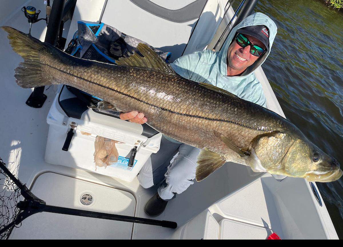 Tampa Bay charter captain TJ Stewart poses with a snook.