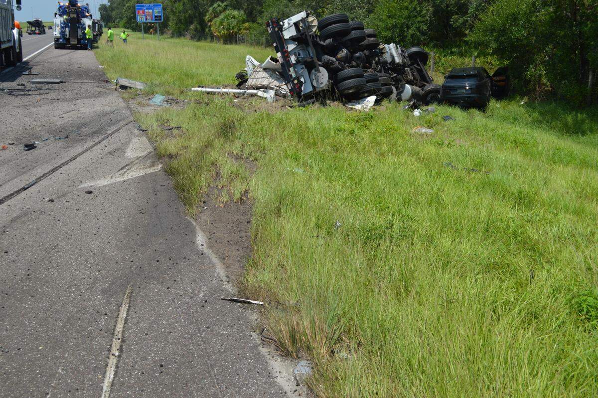 Florida Highway Patrol says a crane truck overturned on I-75 at mile marker 217 in Manatee County Thursday afternoon after losing tire pressure and colliding with a Land Rover.