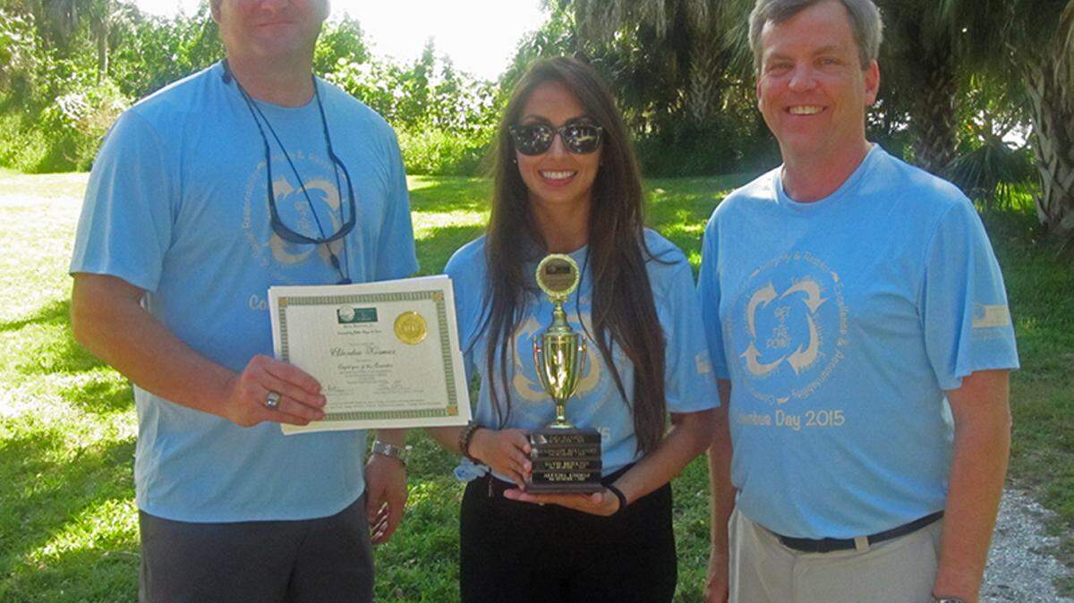 Alex Kosmas, who was selected as the Tax Collector's Employee of the Quarter, stands with Tax Collector Ken Burton Jr. and Tony Conboy. 
 PHOTO PROVIDED