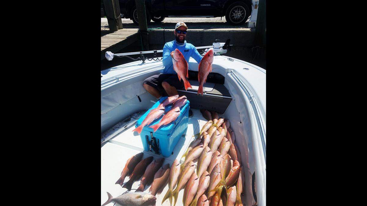 Capt. Jason Stock with a catch of red, yellowtail, and mangrove snapper from Tuesday.