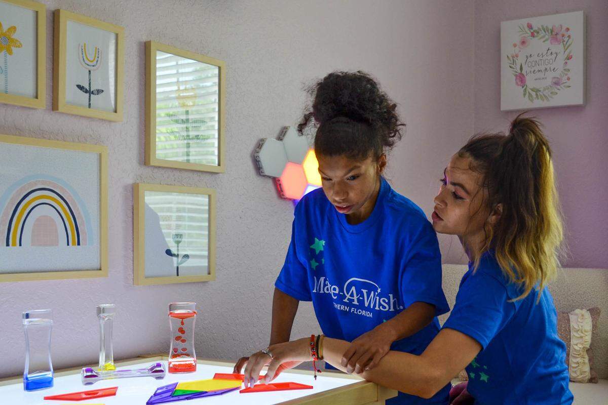 Nayeli Santo and her mom, Adriana Gonzalez, inside their Bradenton home plays with shapes together on a sensory table she received from the Make-A-Wish foundation as apart of her room makeover.
