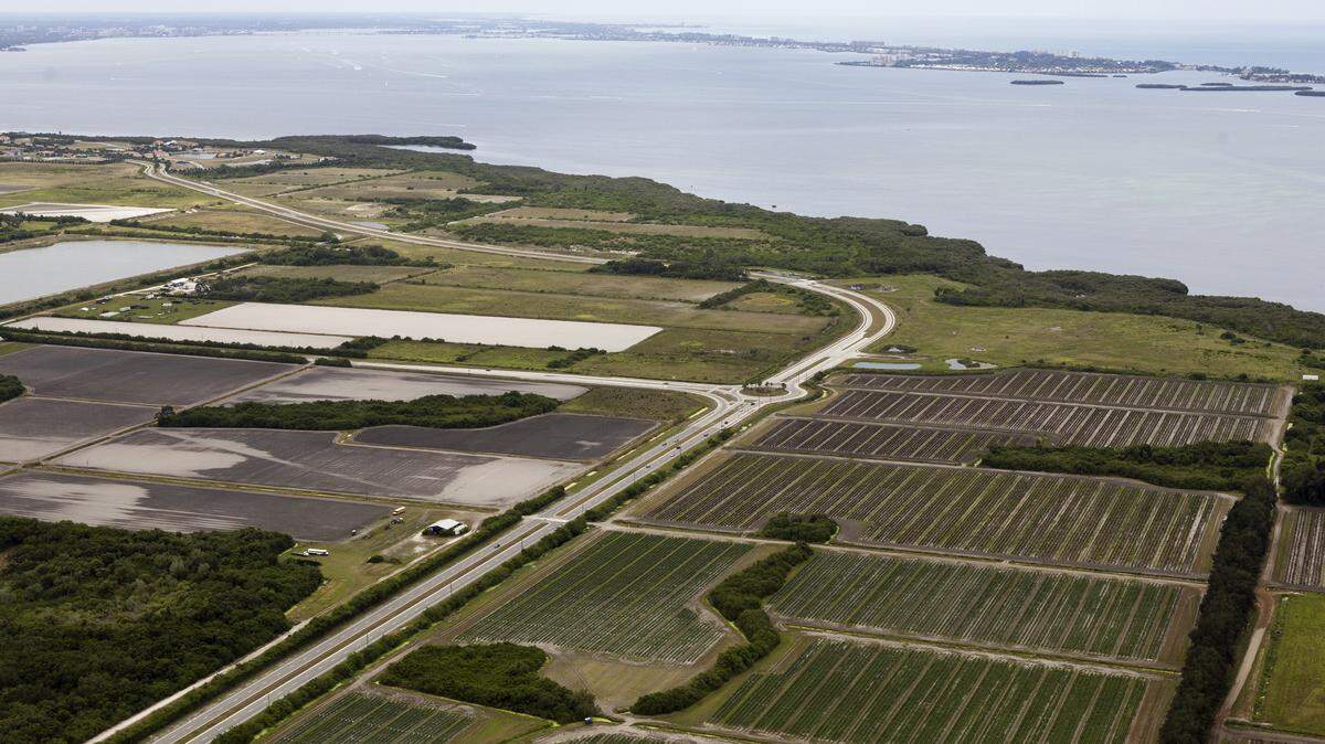 The developers of the 3,200-home Aqua by the Bay subdivision have withdrawn their application to build a mitigation bank near Long Bar Pointe. Photo by Troy Morgan/PHOTOSFROMTHEAIR.com