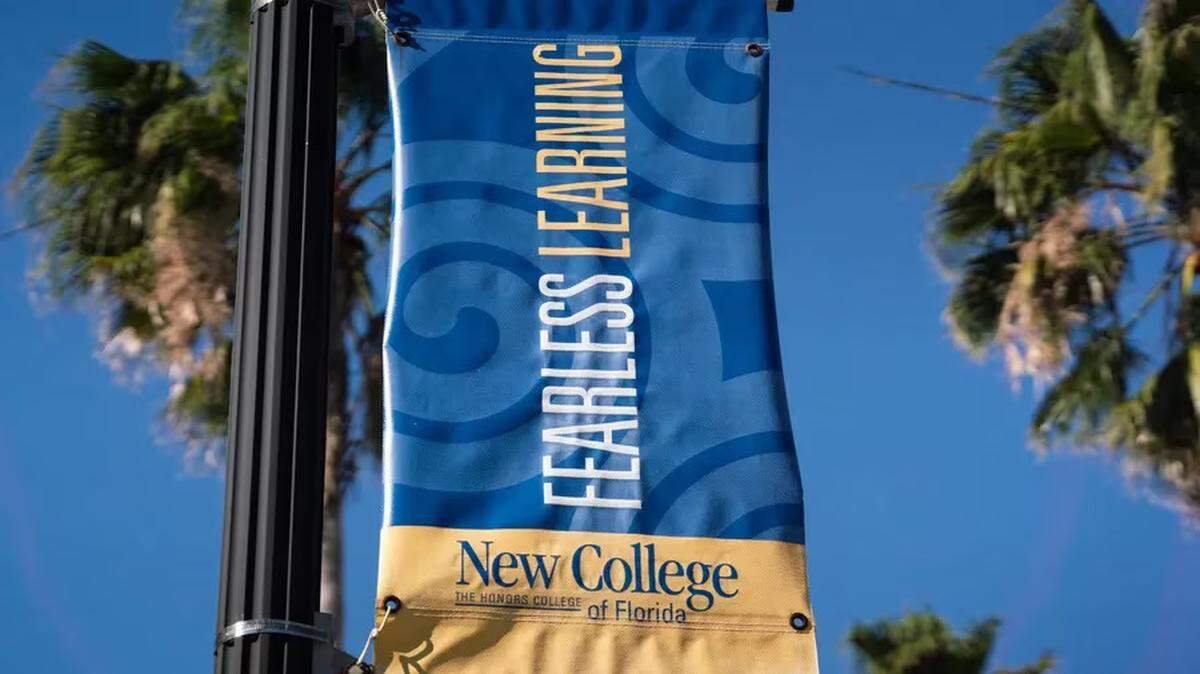 A New College banner is pictured on Jan. 10, 2023, at the Sarasota campus, days after Gov. DeSantis appointed six new members to the school’s board of trustees. Since then, 36 faculty members have left, school officials say.
