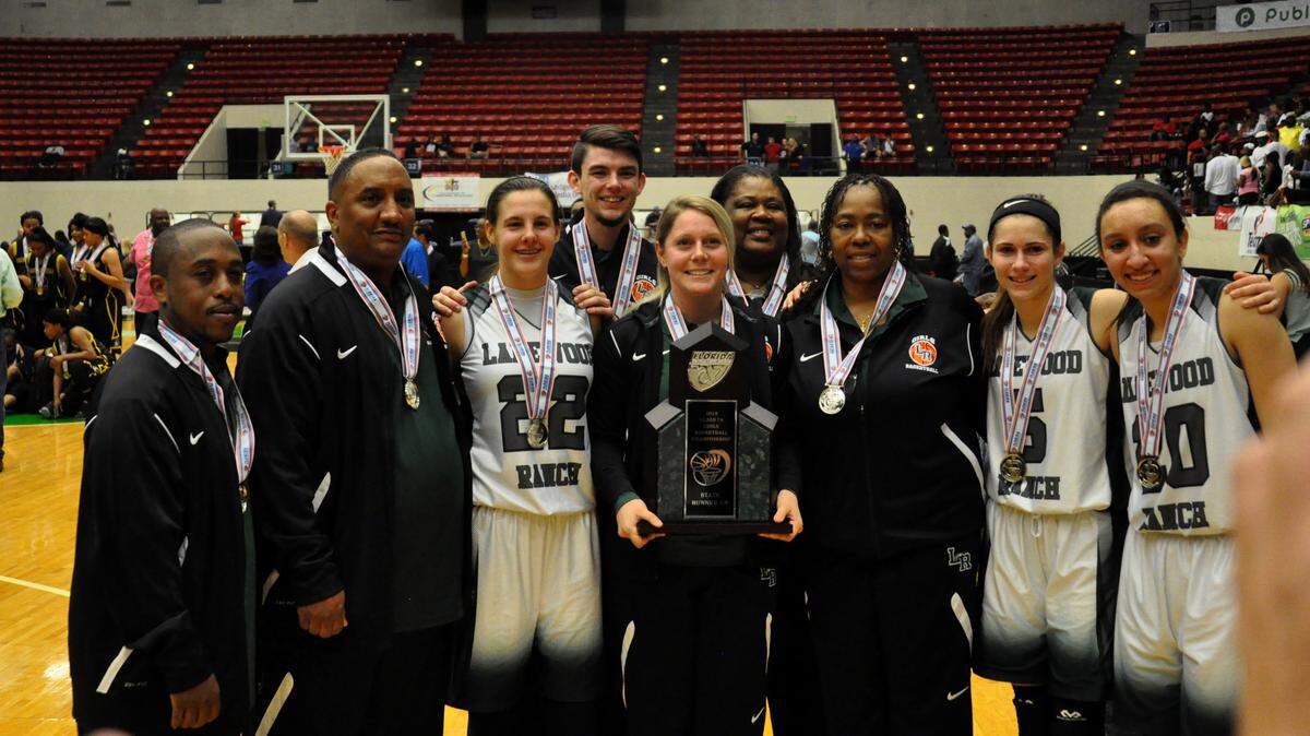 Lakewood Ranch seniors and coaches pose with the runner-up trophy after Saturday's Class 7A state final in Lakeland. CHARLES A. BAKER III/Special to the Herald