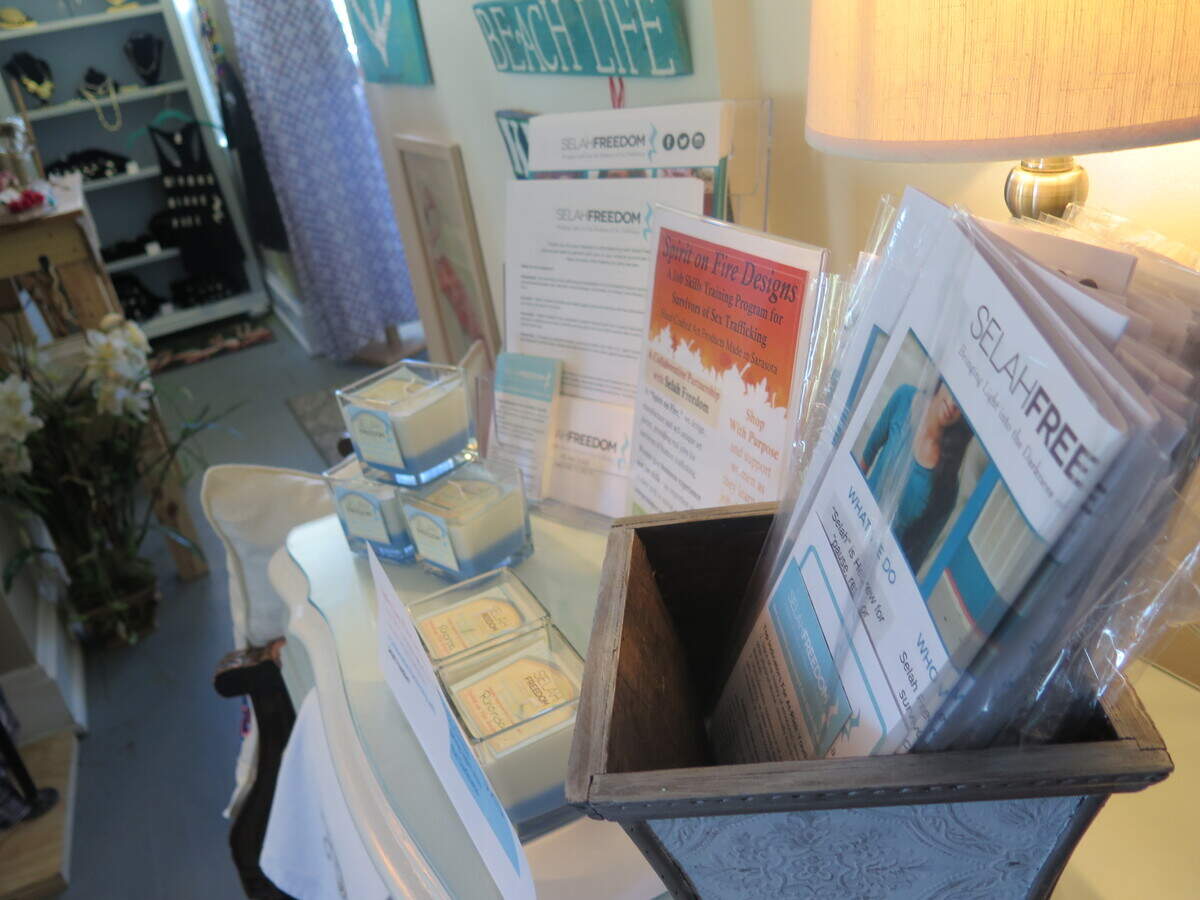As soon as shoppers enter the Selah Vie shop, they're met with an information desk containing pamphlets and brochures about Selah Freedom's mission to combat human trafficking.
