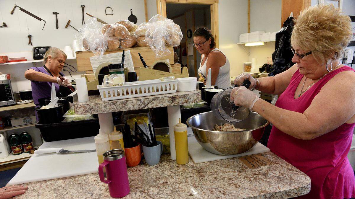 Employees at JP’s Sandwich Shop in downtown Parrish prepare food for the lunch crowd in this Bradenton Herald file photo.