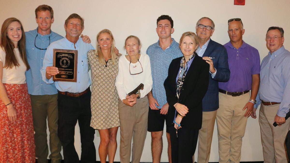 Daniel Carl “DC” McClure, the 2023 Manatee County agriculturist of the year award recipient, is joined by his family 11/14/2023.
