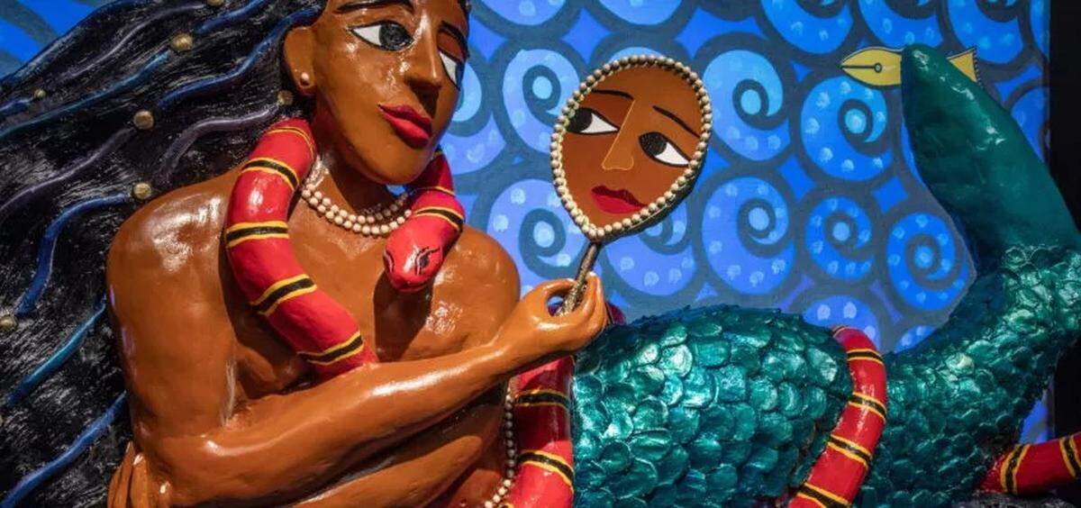 The African water spirit Mami Wata is one of the mythic beings explored in an exhibit at The Bishop Museum of Science and Nature titled “Giants, Dragons & Unicorns: The World of Mythic Creatures.”