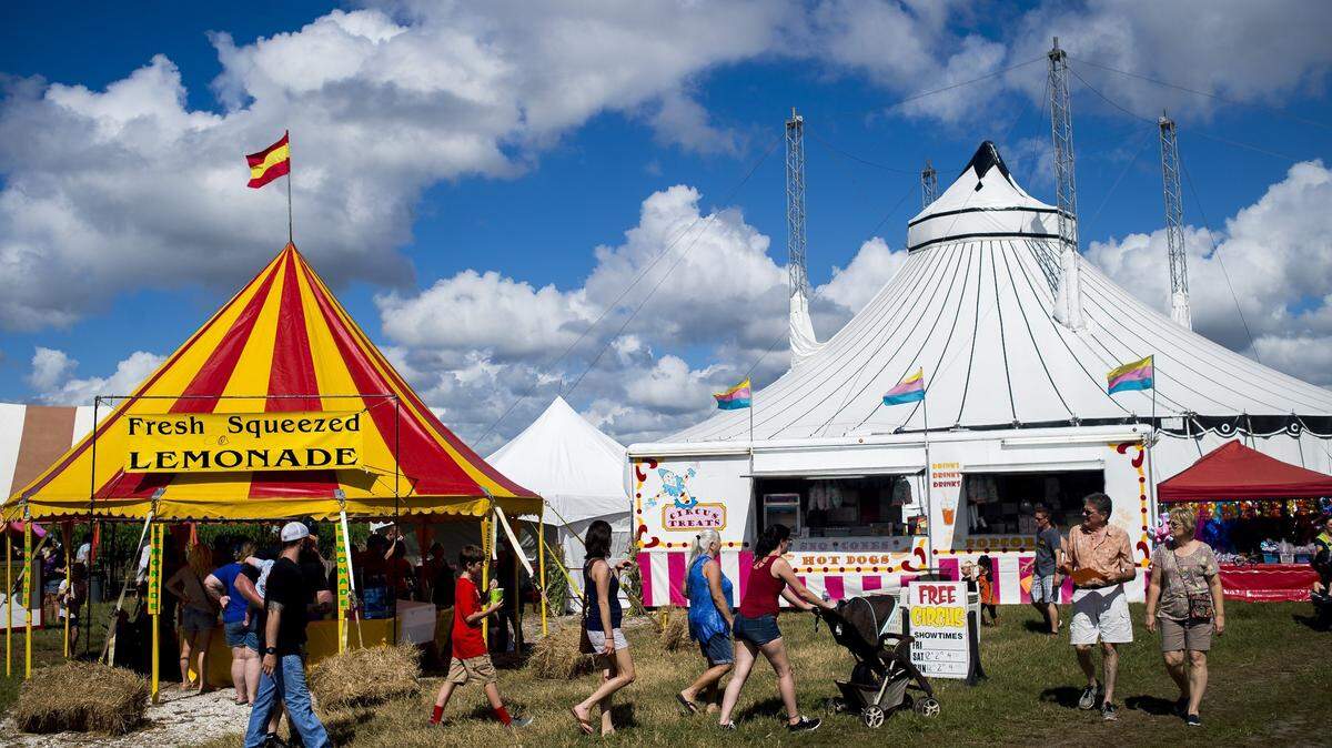 Festival-goers browse shops and activities during the Hunsader Farms 26th Annual Pumpkin Festival in east Bradenton. The 31st Annual Pumpkin Festival kicks off this Saturday.