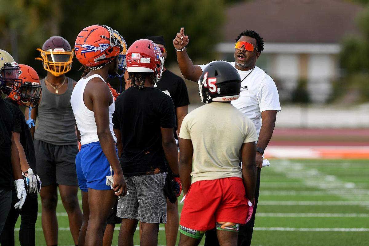 12/28/21—Southeast Coach Shawn Phelps at practice with local players for the Florida Suncoast Senior Showcase, which gives high school football players a chance for scouts to see their abilities before signing day.