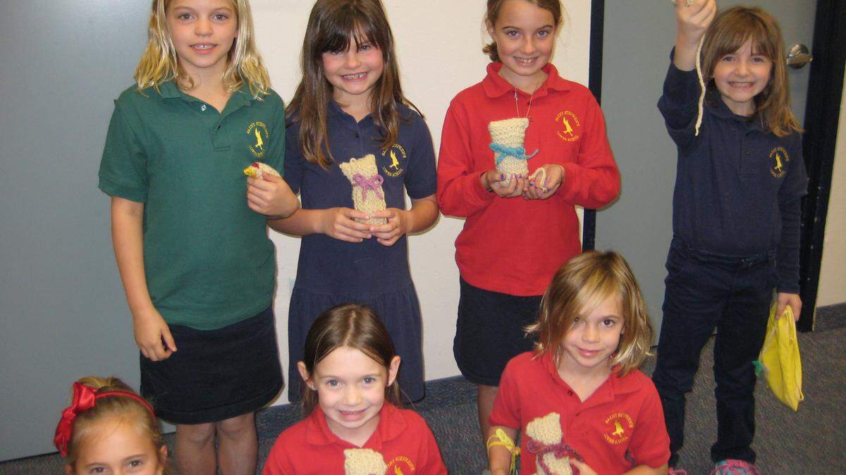 Children display their creations from Deb Cogan's handwork class. PROVIDED PHOTO