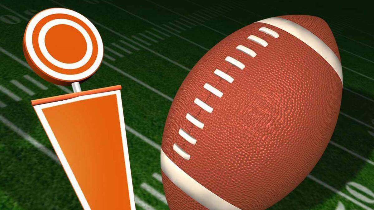 Color illustration of a football and sideline marker on a football field. KRT 2001