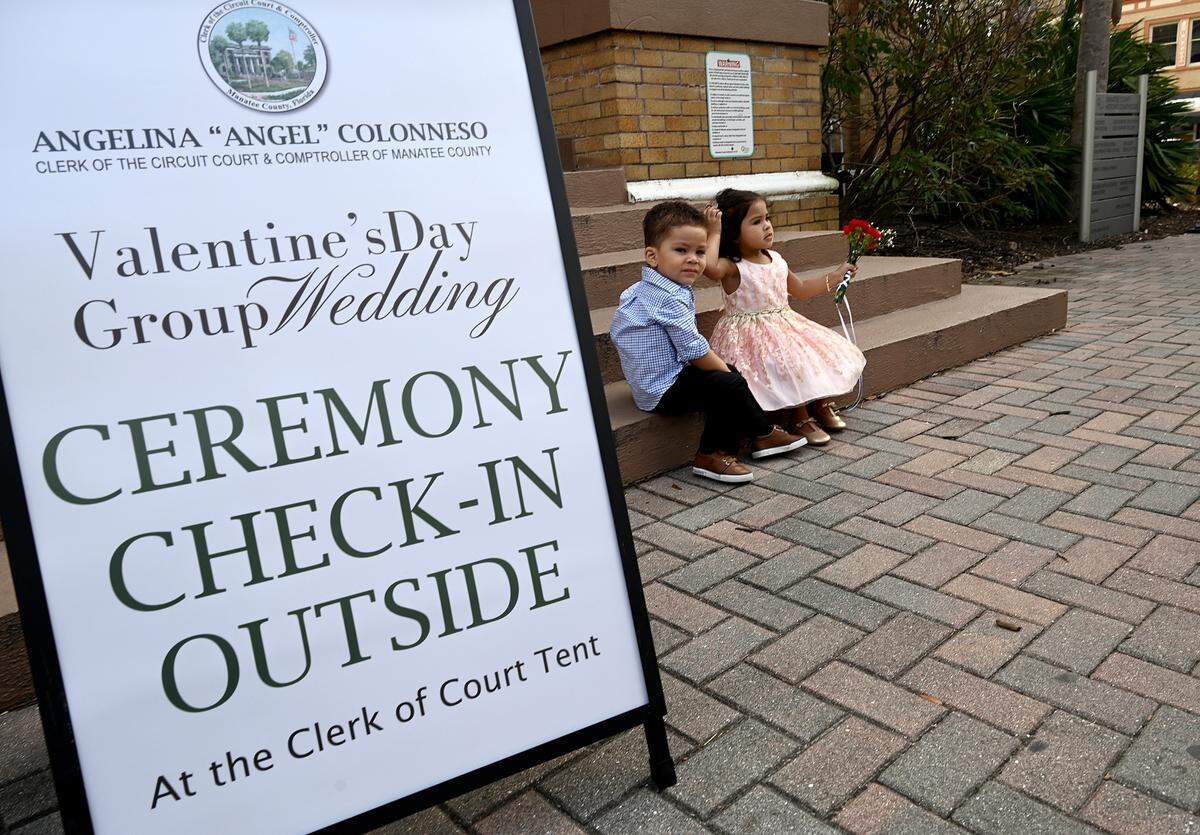 Kylian Acosta and Jairy Herrera, both 2 years old, at the Fifth Annual Valentine’s Day Group Wedding in the courtyard of the Manatee County Historical Courthouse.