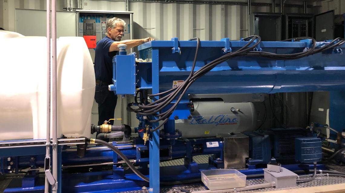 Paul Falco works on a cellular concrete mixer that is slated to be shipped to Bangladesh to lay down road base.