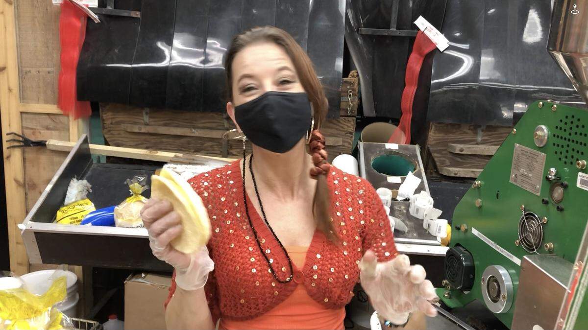 2/10/2021--Teresa Cunningham holds freshly made Broghies at Mixon Fruit Farms. Mixon is now the U.S. distributor for the popped grain wafers.