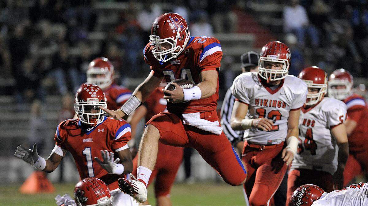 In this Bradenton Herald file photo, Manatee's Cord Sandberg seems to fly over St. Petersburg Northeast's defense for a touchdown.