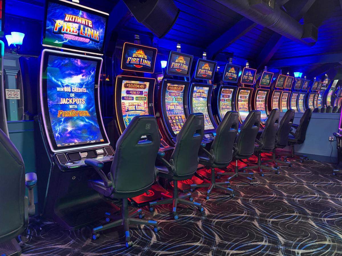 Slot machines are lined up inside Good Times Arcade in Bradenton during a gambling raid in August 2025, where deputies say they seized 55 machines and more than $160,000, according to the Manatee County Sheriff’s Office.
