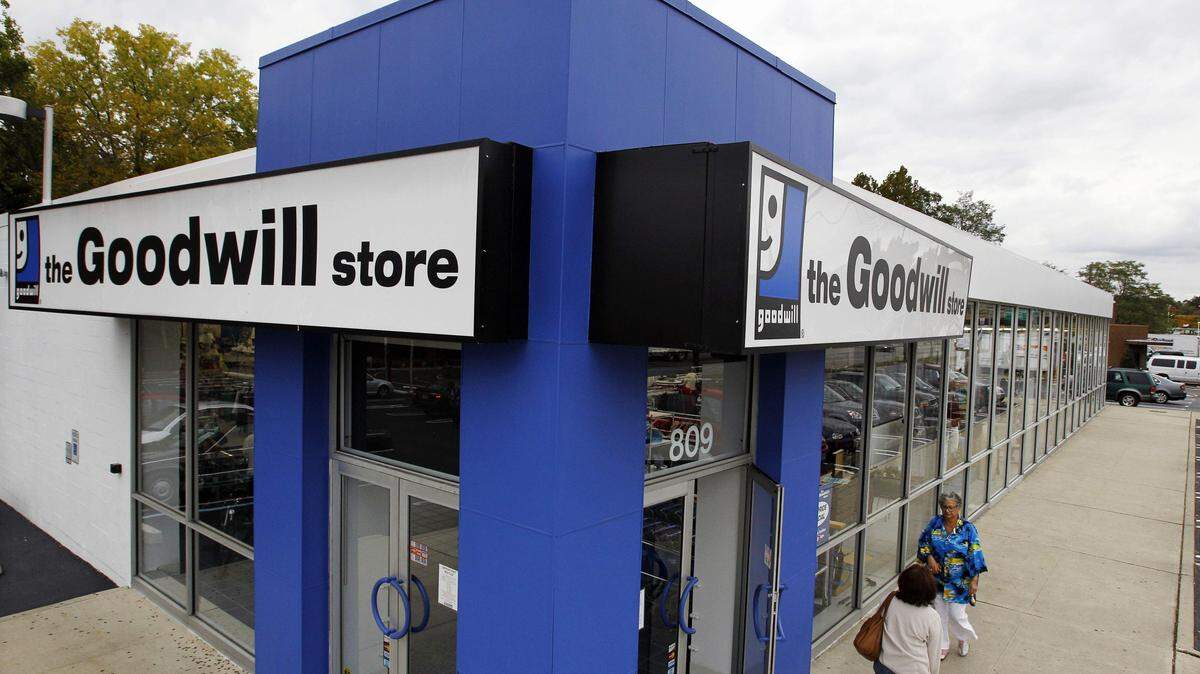 FILE - In this Oct. 14, 2010 photo, shoppers go into a Goodwill store in Paramus, N.J. Did you donate a car to a charitable organization in 2015 or some clothing to the church thrift shop or Goodwill store? If you want to take a deduction for the donation, you have to itemize on your tax return. (AP Photo/Mel Evans, File)