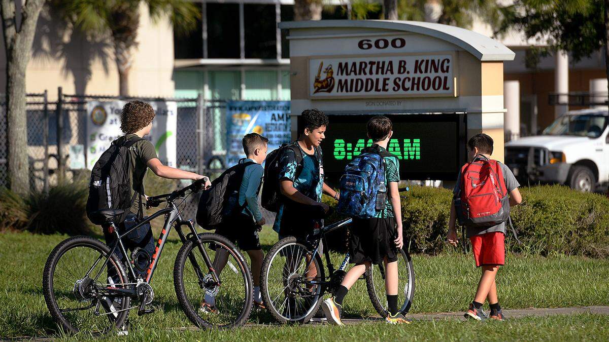 08/09/21—Middle school students head for Martha King Middle School on the first day of classes in Manatee County.