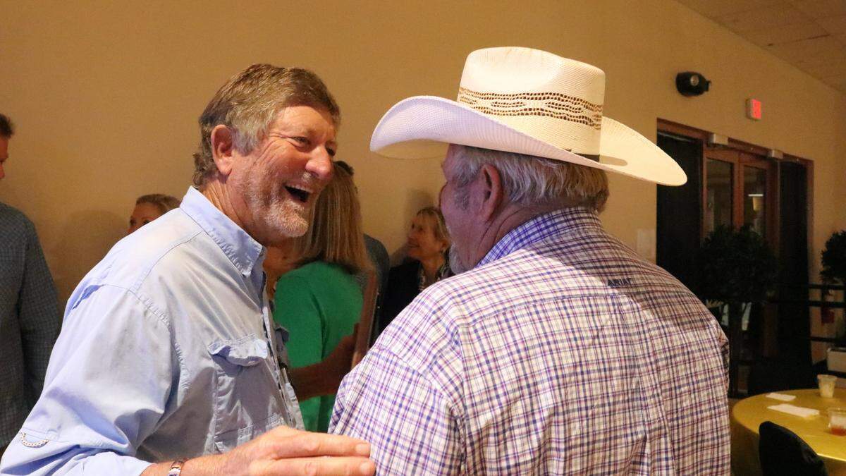 Daniel Carl “DC” McClure, left, the 2023 Manatee County agriculturist of the year award recipient, greets Mitchell John, the 2017 recipient.