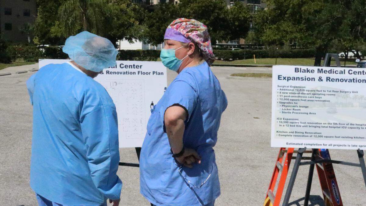 4/8/2021--Hospital staff members check out plans for the expansion of Blake Medical Center.