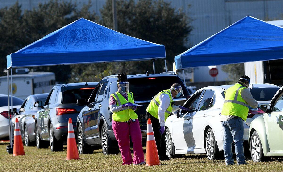 12/30/20--Residents 65 and over lined up to receive the Moderna vaccine at the Manatee County Public Safety complex.