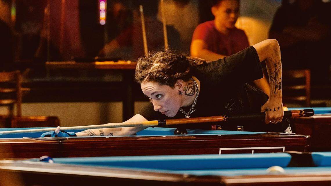 Manatee County’s Taylor Marlow lines up a shot in preparation for the World Billiards Championship in Las Vegas, which starts Thursday, August 8, 2024. Marlow is competing with her Manasota APA team called the Young Guns.