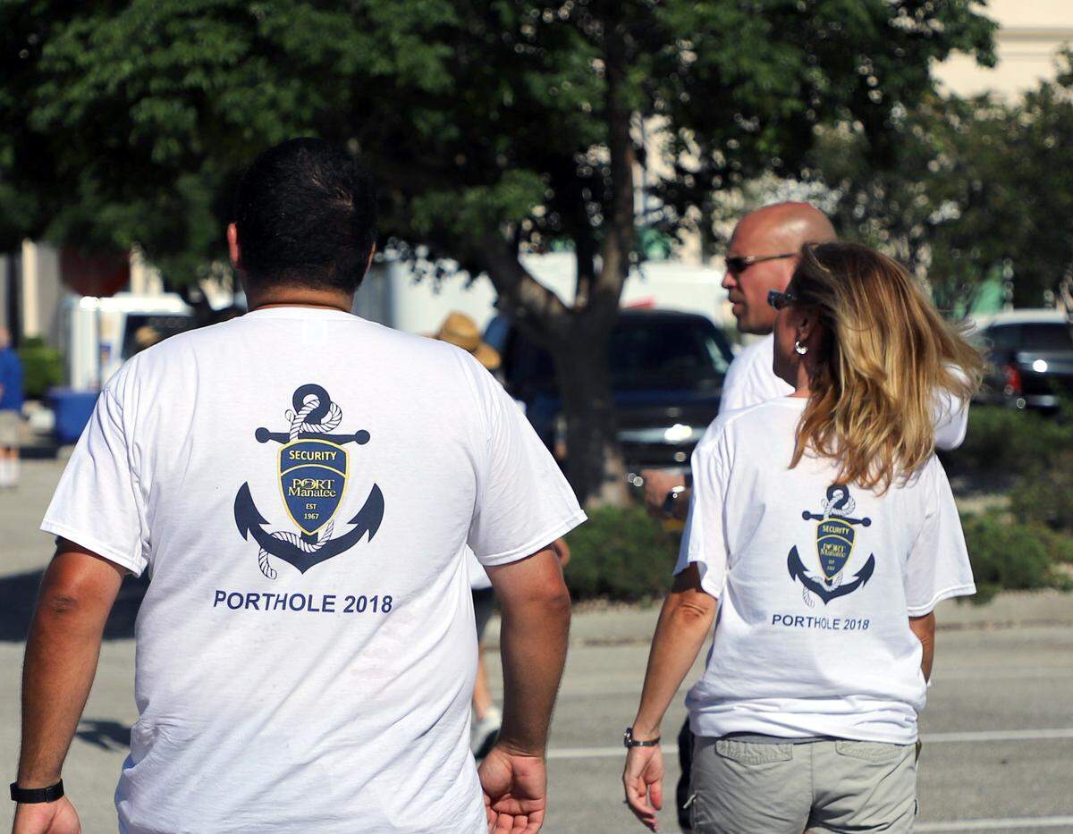 Members of Port Manatee’s security team take part in Porthole 2018, a cornhole-like event that raised funds to help send local students to Guatemala to build schools.