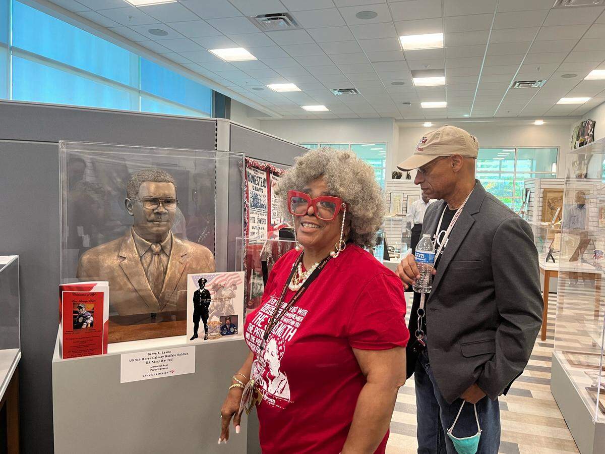 Heritage House Museum Specialist Kathie Marsh smiled as she led a tour of the museum to kick off its 32nd anniversary celebration Friday evening. Harriet Tubman’s relative, A.J. Brickler, looks at a statue of Steve Lewis, a Buffalo soldier and longtime educator in Manatee County. 05/14/2022.