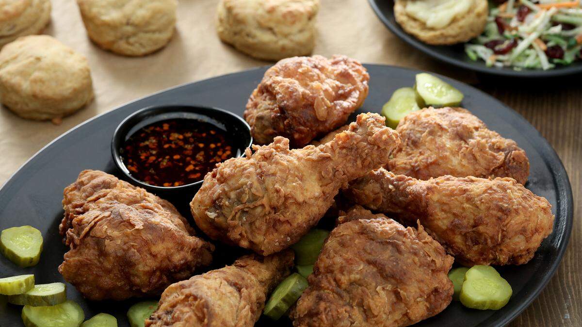 A spicy dipping sauce sweetened with agave syrup and flavored with hot sauce and red pepper flakes ups the heat factor. Smoked cheddar and sweet potato biscuits are great companions. (Michael Tercha/Chicago Tribune/TNS)