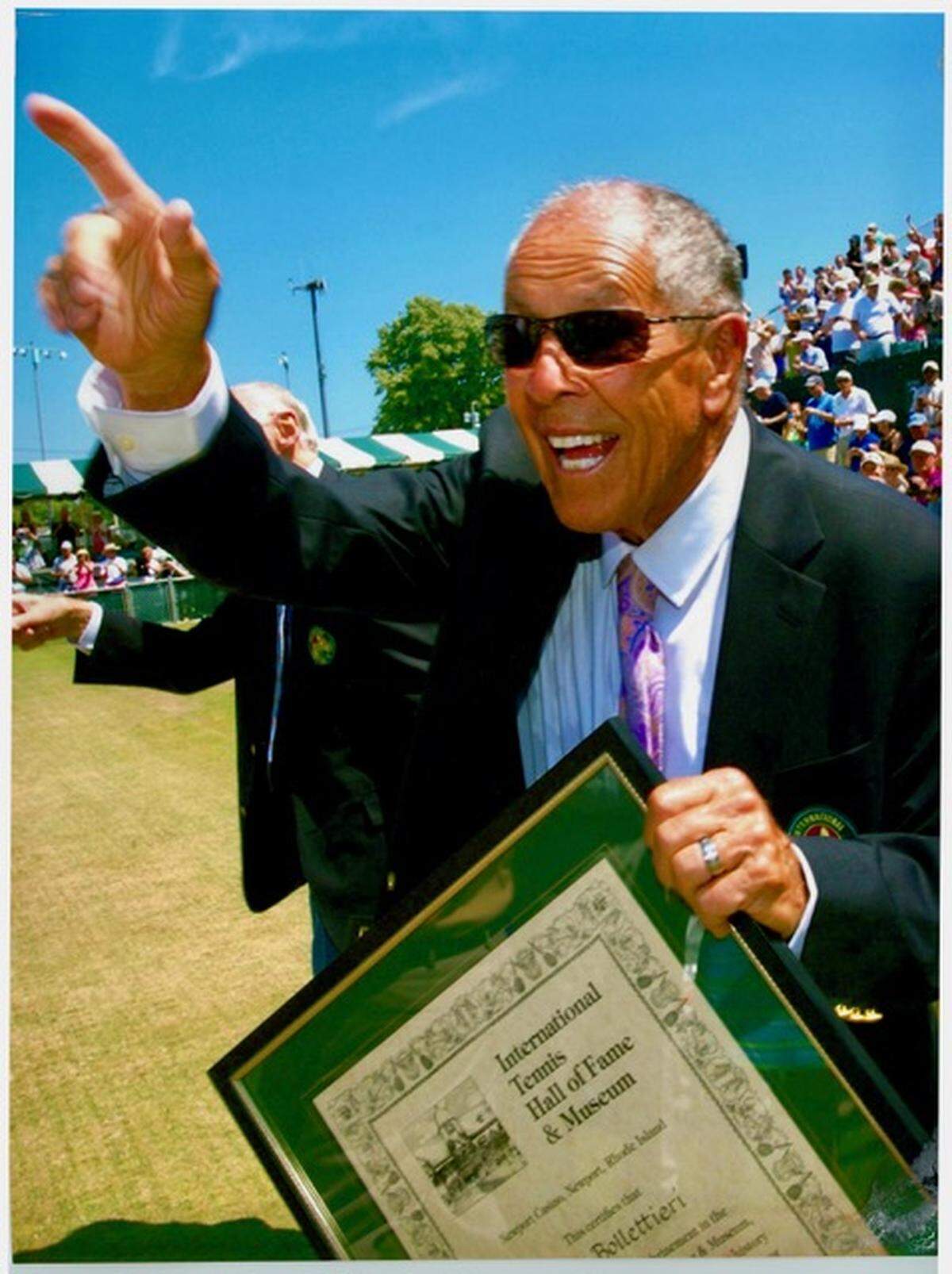 Nick Bollettieri holding the certificate from his induction into the International Tennis Hall of Fame, 2014.