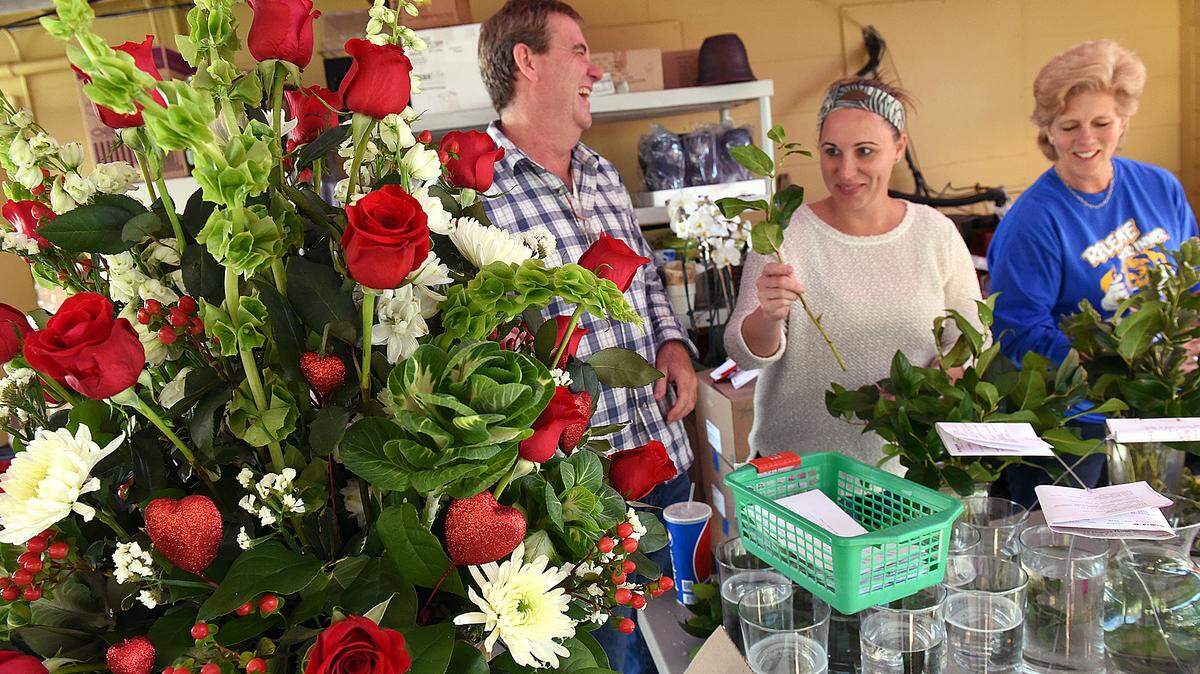 Three generations of Joseys work for Josey's Poseys, including Kevin Josey, Melissa Mendiola and Liz Altenbernd, working on bouquets and arrangements for Valentine's Day. 
 TIFFANY TOMPKINS/Bradenton Herald