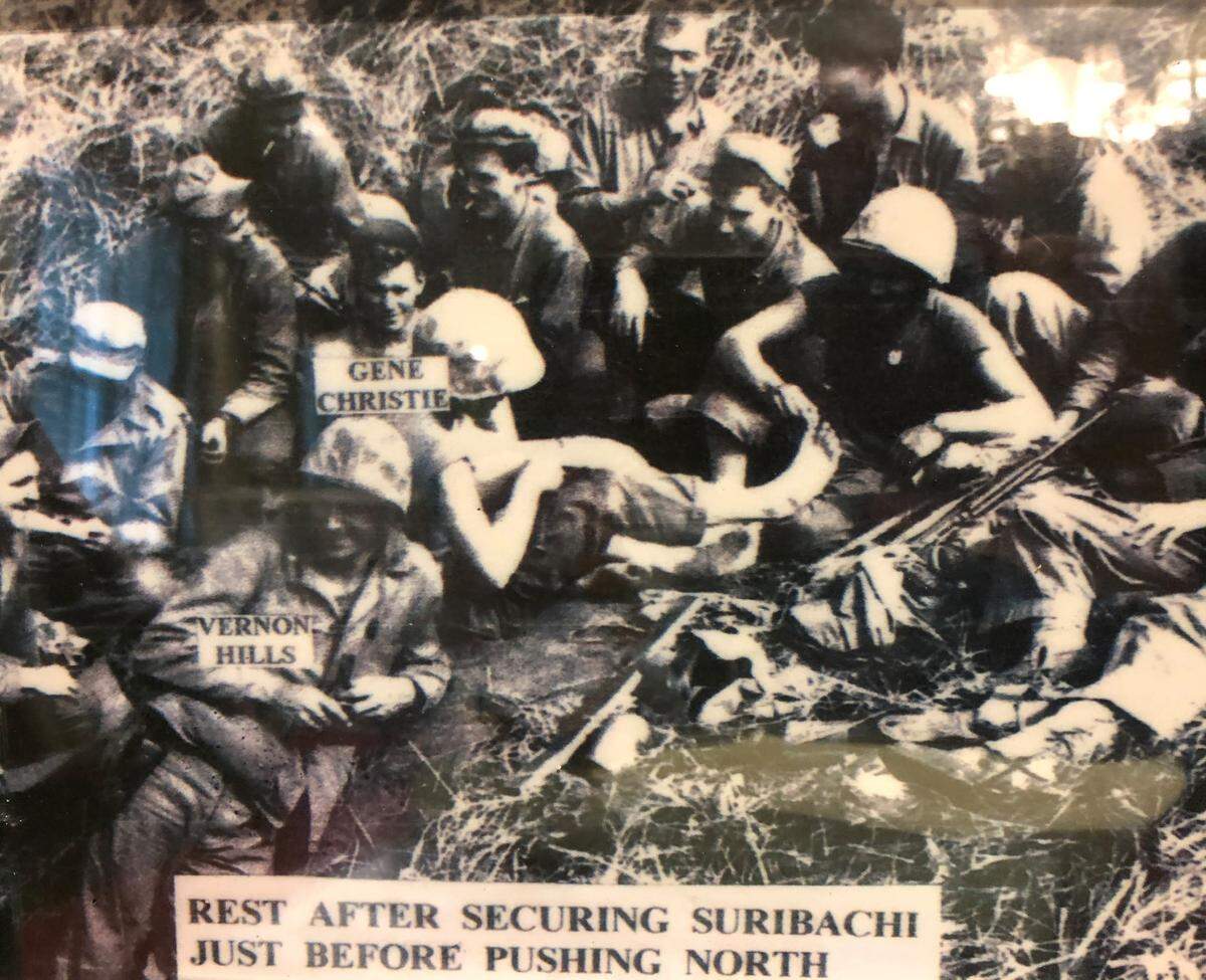 Gene Christie and fellow Marines are shown after capturing Mount Suribachi on Iwo Jima in one of the fiercest battles of World War II.