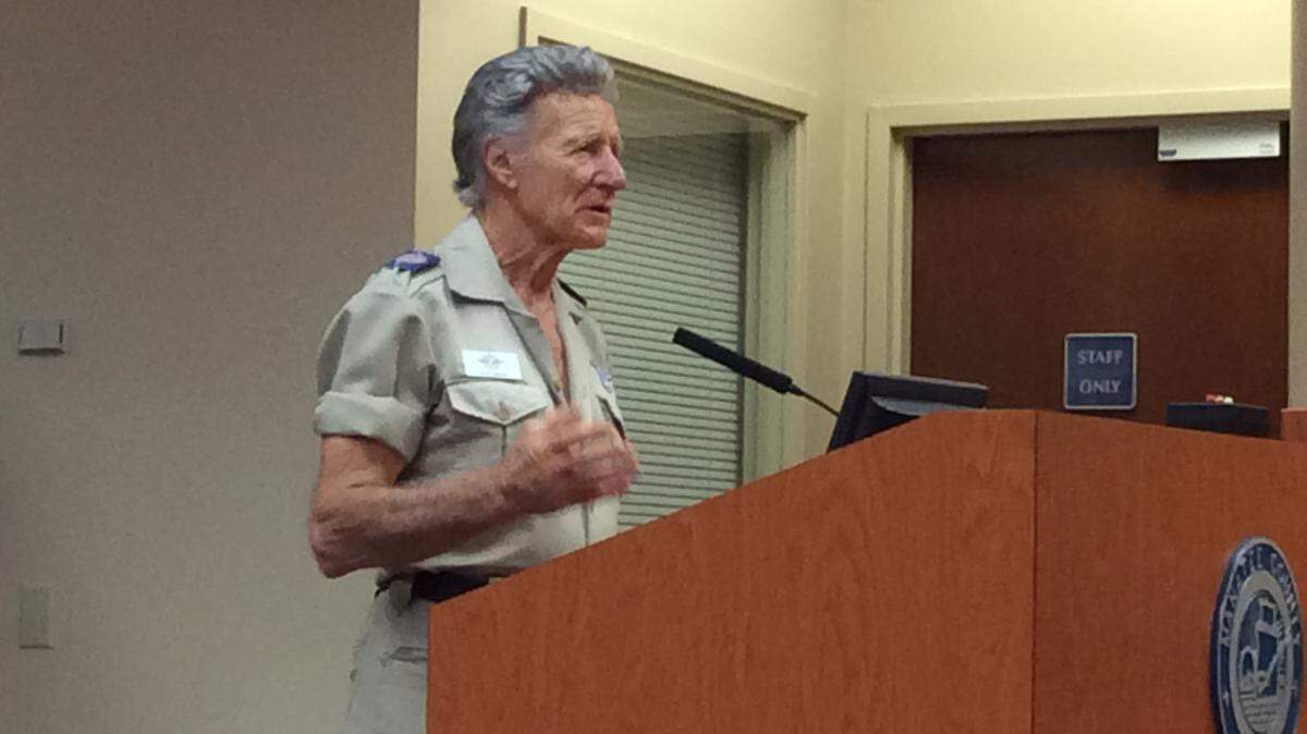 Stan Brock, left, founder and president of Remote Area Medical Volunteer Corps, addresses Manatee County commissioners Tuesday about the upcoming two-day health care clinic to be put on by his organization in November. 
 RICHARD DYMOND/Bradenton Herald