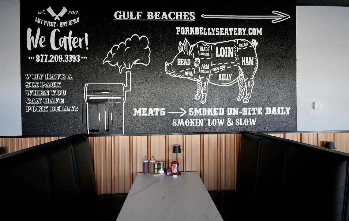 A wall mural over some of the tables at Pork Belly’s, 9516 Cortez Road West.