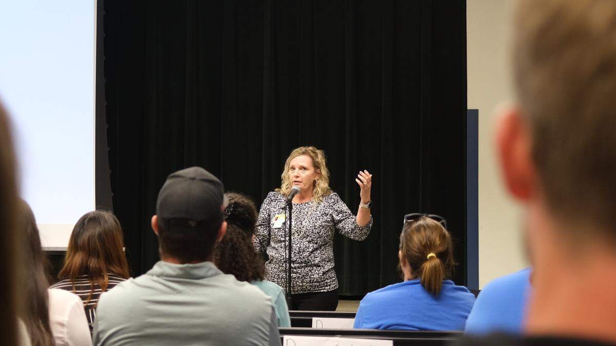 Palma Sola Elementary School principal Jennifer Grimes addresses hundreds of community members at a meeting to address rumors about the school potentially closing.