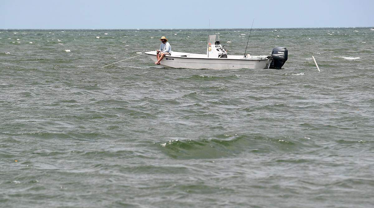 06/22/21—A boater fishes in the waters near the keys and small islands of Terra Ceia. The State of Florida wants to preserve 2,300 acres of environmentally sensitive Terra Ceia mangrove swamps and flatwoods.