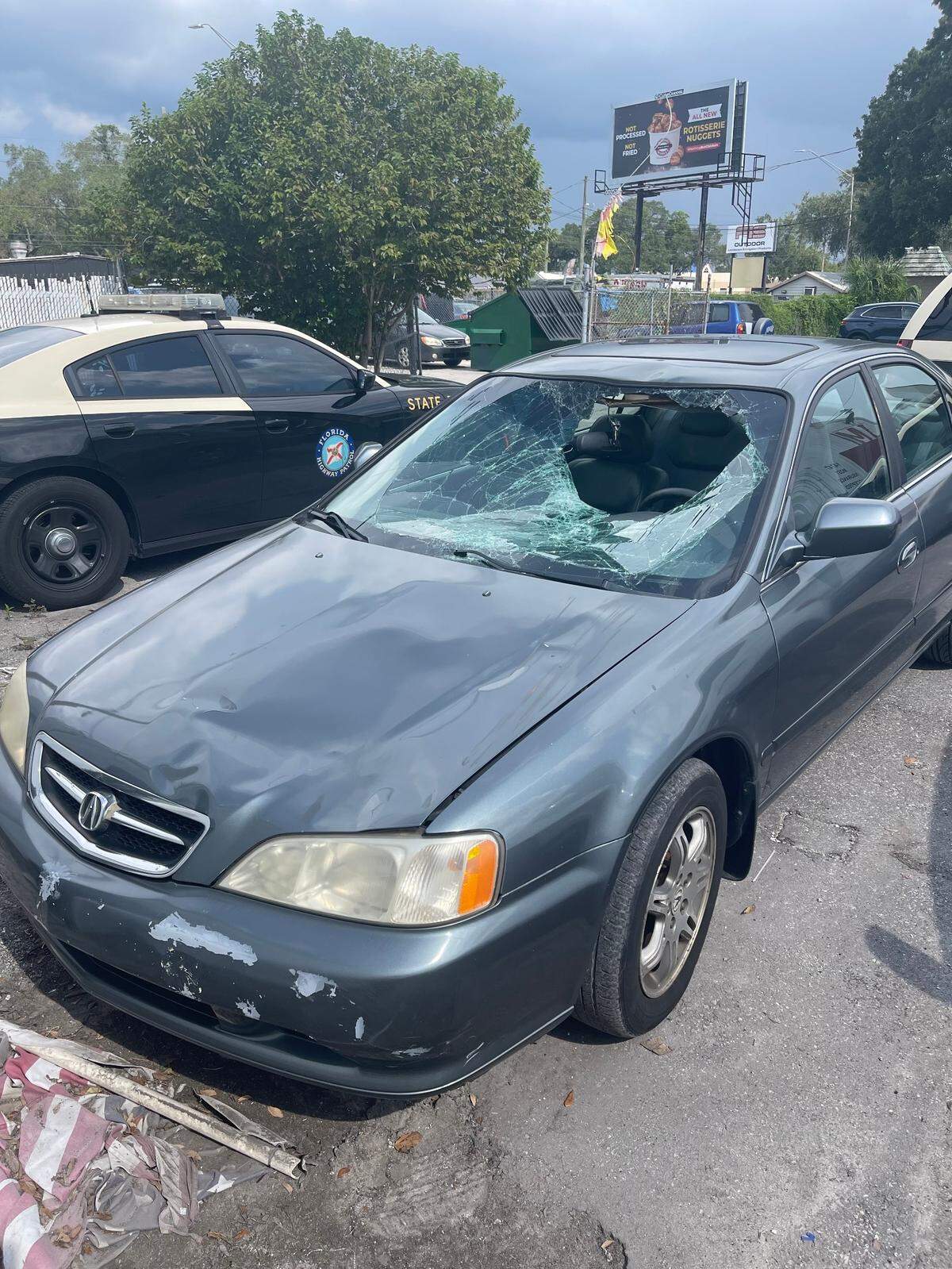 This dark silver sedan’s windshield was damaged after the driver hit a 13-year-old bicyclist at a school crosswalk on Tuesday, Aug. 16, 2022, Florida Highway Patrol said.