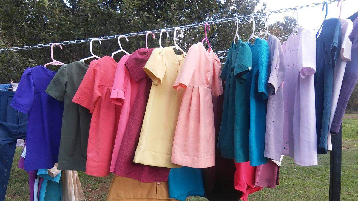Rainbow hues strike the eye as 2-year-old granddaughter Abigail’s homemade dresses dry after washing.