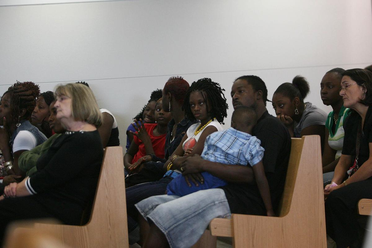 Accompanied by two victim advocates, the family of 9 year-old Stacy Williams III watch testimony in the trial of Orlando Valenzuela during his trial for the murder of Stacy at the Manatee County Courthouse in Bradenton.