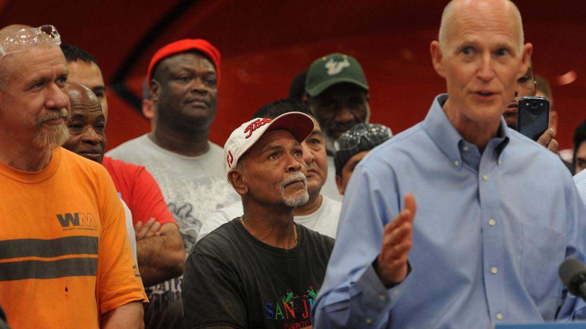 Workers at Marine Concepts listen as Florida Gov. Rick Scott speaks Friday about job growth in Florida. It was the second-to-last stop on his victory lap for Florida adding more than a million jobs since 2010. 
 GRANT JEFFERIES/Bradenton Herald