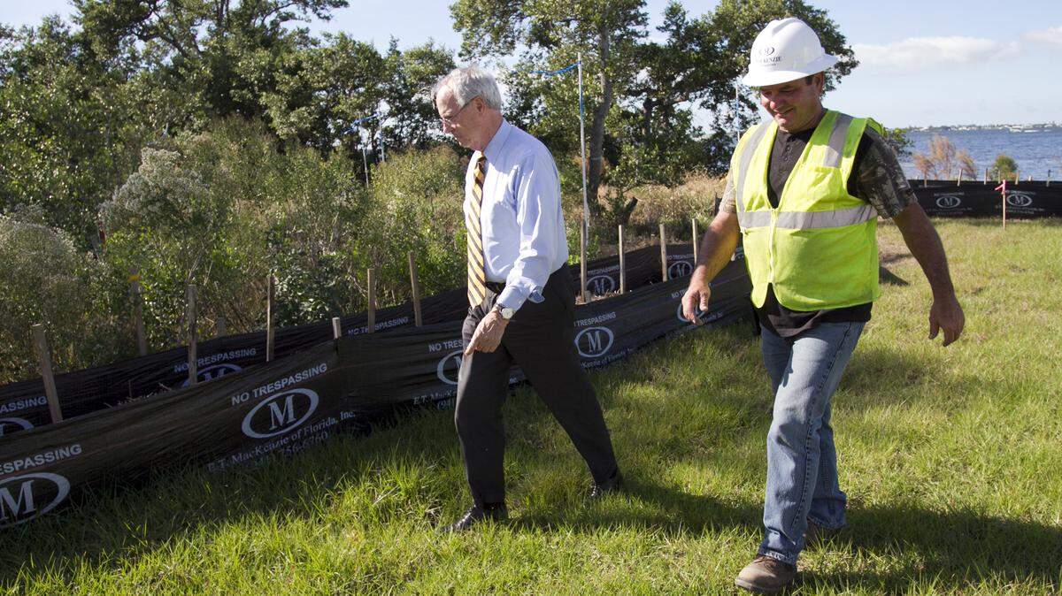 Pat Neal tours the construction site at his planned four-home Harbor Sound subdivision with construction superintendent Mitch Lloyd. MATT M. JOHNSON/Bradenton Herald