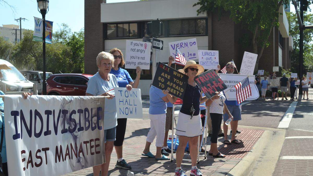 Demonstrators with local political groups gathered in front of Vern Buchanan’s Bradenton office on May 20, 2019, to demand that he hold a district-wide town hall to discuss the findings of the Mueller Report.