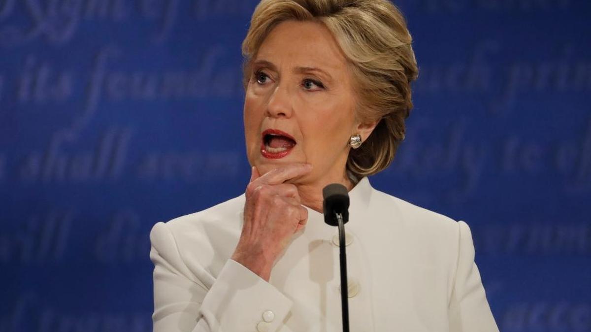 Democratic presidential nominee Hillary Clinton listens Wednesady to Republican presidential nominee Donald Trump during the third presidential debate at UNLV in Las Vegas.