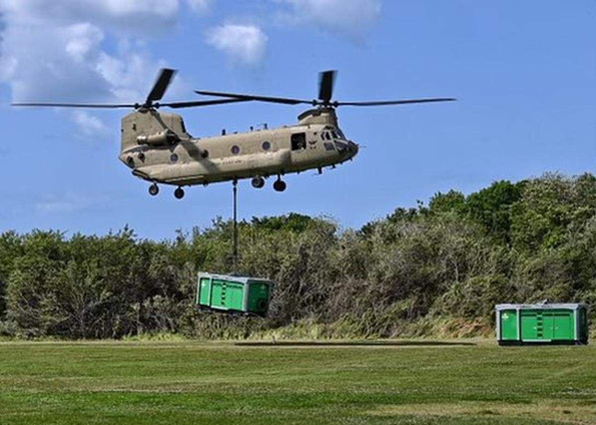 04/04/21--Two CH-47s working with partners in response to the Piney Point Reservoir leak conducted an overflight Sunday with Governor Ron DeSantis and placed two pumps to help lower the water level enough to repair the leak.