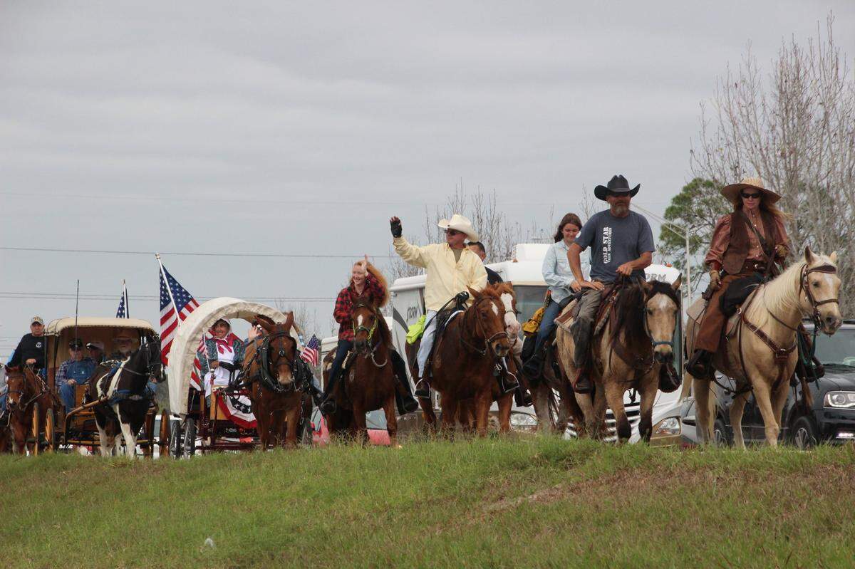 2/19/2017--Riders in the 30th-annual Cracker Trail Ride waved to well wishers in 2017 along State Road 64 as they rode out of Bradenton.